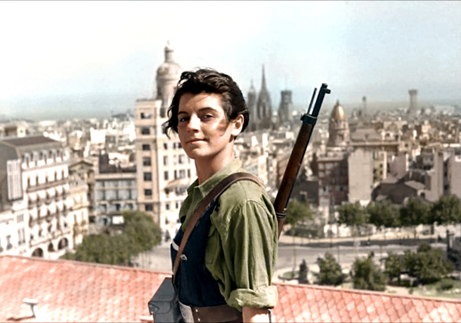Defiant at 17, Marina Ginestà stands tall above Barcelona, a young face of the Spanish Civil War.
